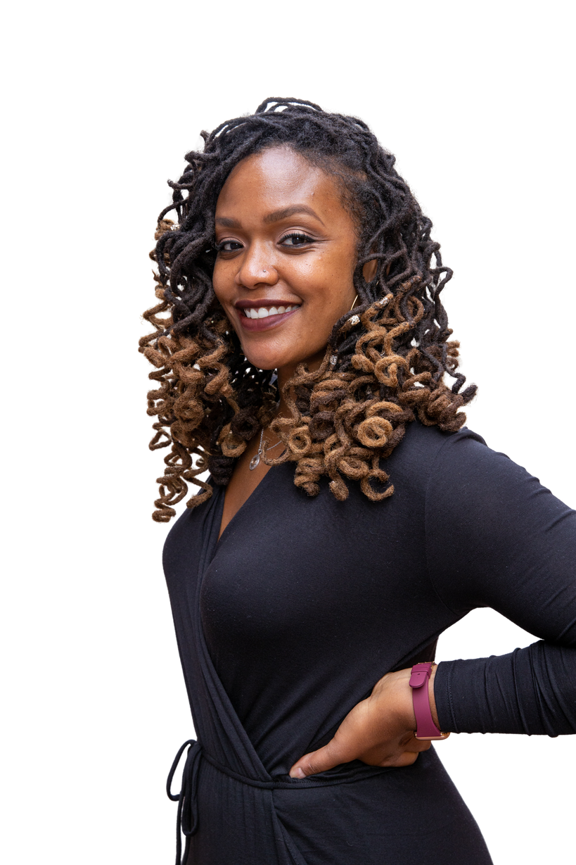 Smiling Woman in Black Dress with Curly Hair Outdoors
